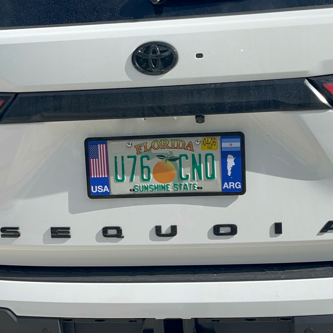 Argentina license plate frame on a white Toyota SEQUOIA patented by DFS
