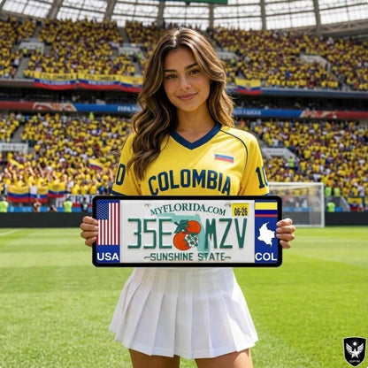 A DFS patented Colombia COL license plate frame holder on a custom Florida sunshine state license plate, featuring the USA flag on the left and the Colombian flag on the right. A woman in a yellow Colombia jersey holds the custom vehicle accessory inside a packed soccer stadium