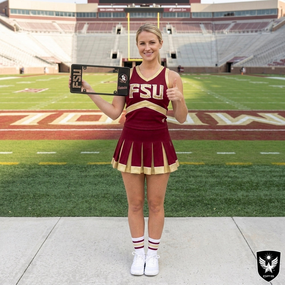 A woman wearing a maroon and gold FSU cheerleader uniform holds an elongated FSU license plate frame on a football field.