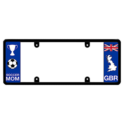 Black license plate frame featuring a white trophy and soccer ball graphic above white Soccer Mom lettering on the left blue panel, and a British Union Jack flag above a white Great Britain map outline and GBR lettering on the right blue panel