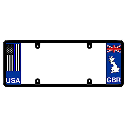 Black license plate frame featuring a thin blue line American flag above white USA lettering on the left blue panel, and a British Union Jack flag above a white Great Britain map outline and GBR lettering on the right blue panel