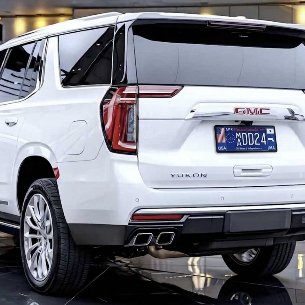 DFS License plate frame with a USA flag and Massachusetts state map outline the 250th birthday of America mounted on a white GMC Yukon SUV by DFS Brands.
