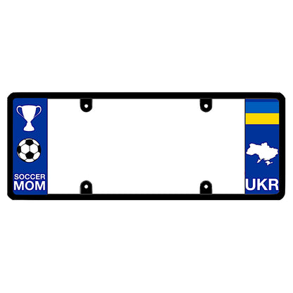 A black elongated Ukraine license plate frame with a soccer mom theme on the left and a blue and yellow Ukrainian flag, map silhouette, and UKR text on the right by DFS Brands.