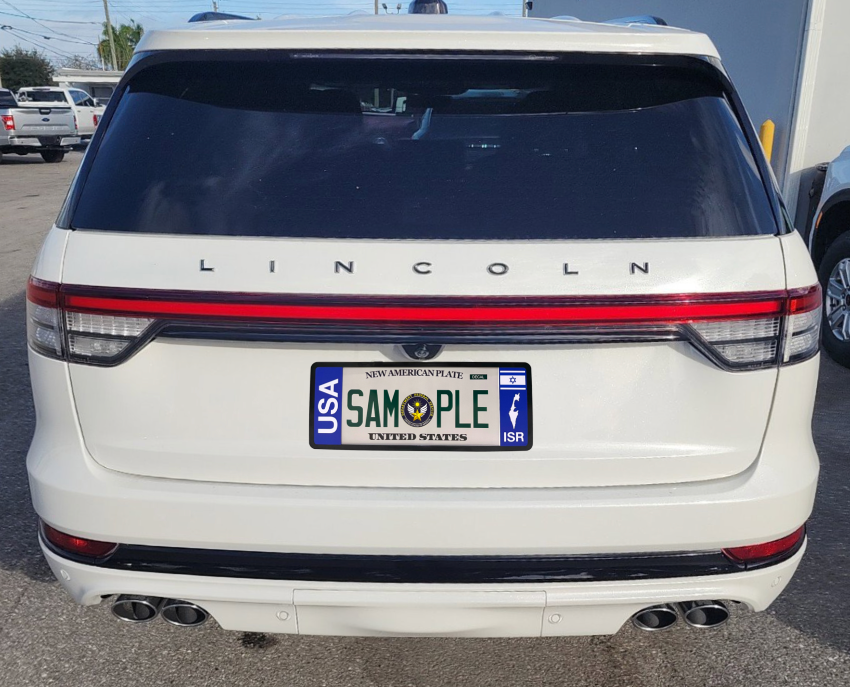 Patented USA-Israel bilateral license plate frame installed on the rear trunk tailgate of a luxury white Lincoln Aviator SUV car
DFS the Official license frame of America 
